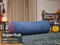 Large blue foam filled SuperSub bean bag in a cozy living room setting.