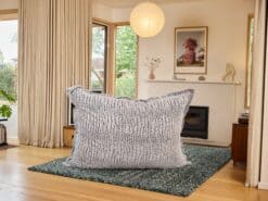 Large Stone Faux Fur foam filled 3-in-1 bean bag in a calm living room setting with natural light.