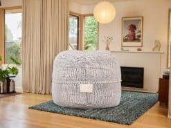 Large Stoen Faux Fur foam filled Grande bean bag in a peaceful living room setting with natural light.